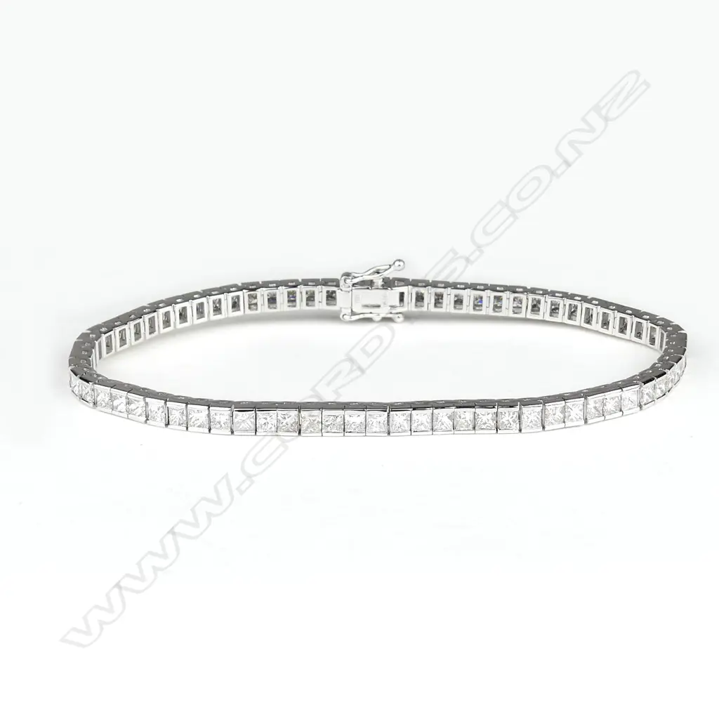 An 18ct. white gold and multi-diamond tennis bracelet Image 1++