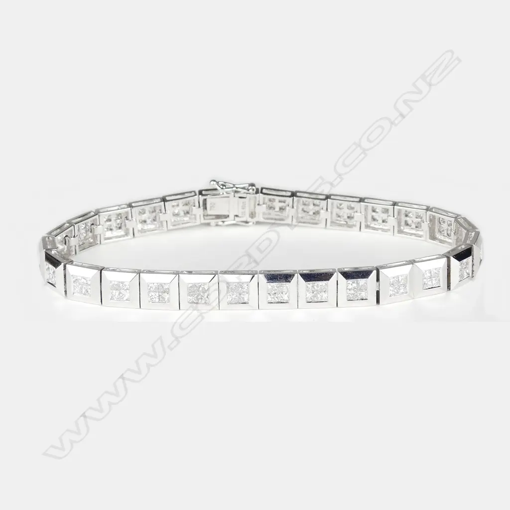 An 18ct. white gold and diamond wide tennis type bracelet Image 1++