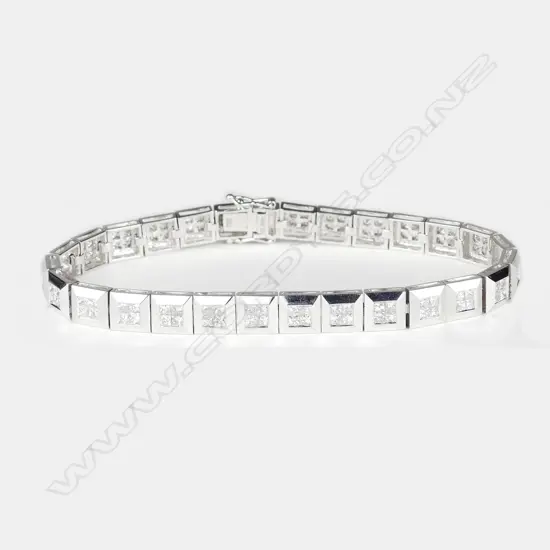An 18ct. white gold and diamond wide tennis type bracelet