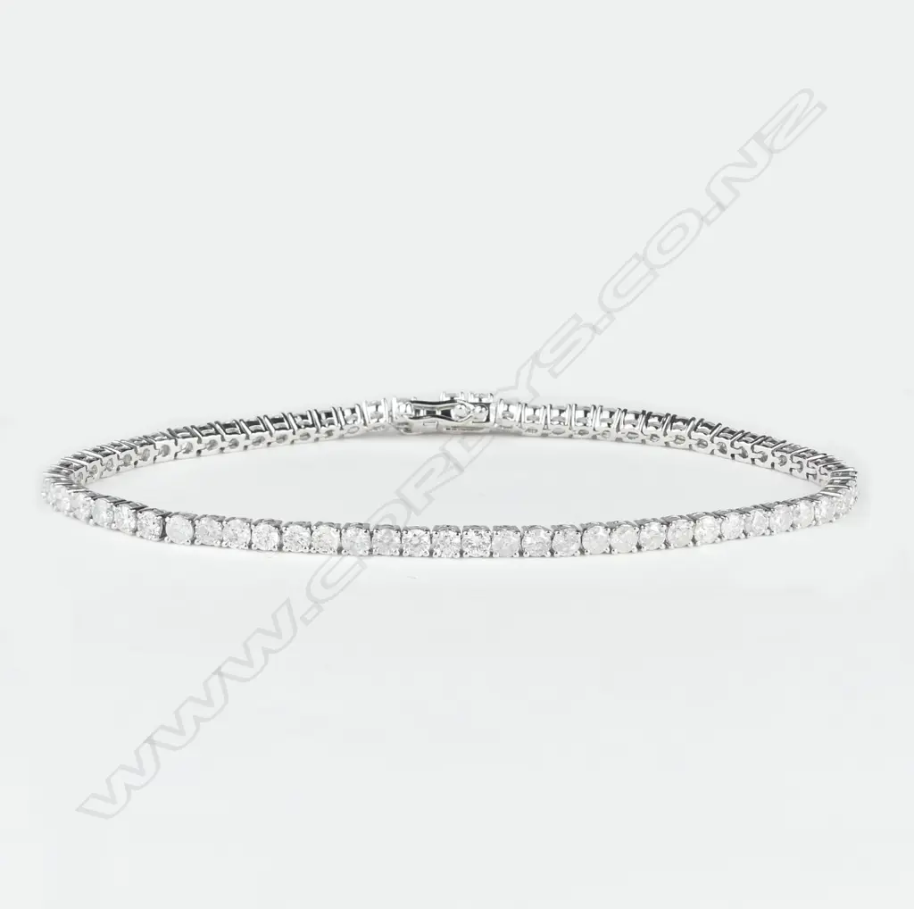 A 14ct white gold and diamond tennis bracelet Image 1++