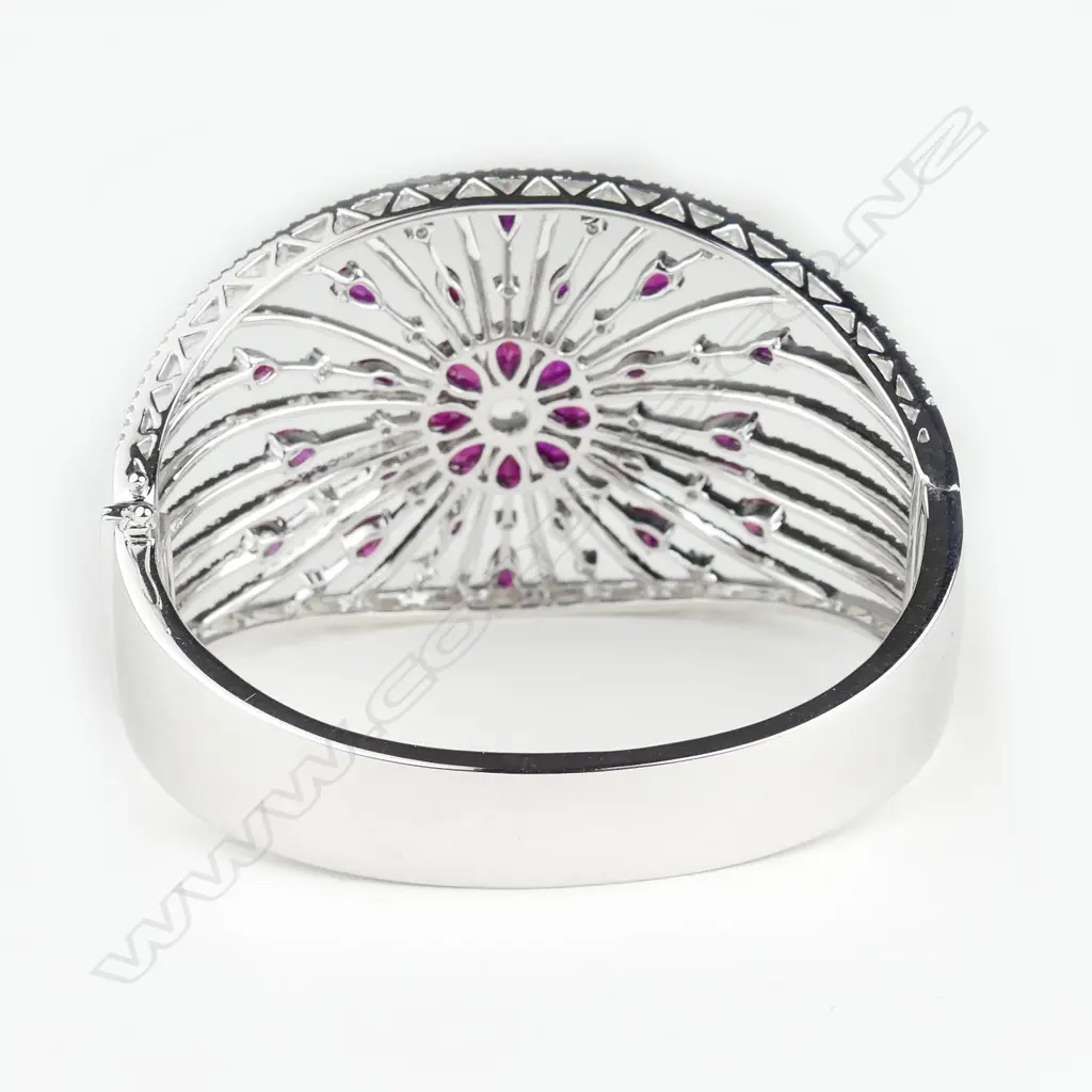 A spectacular 18ct. white gold ruby and diamond wide bangle Image 1++