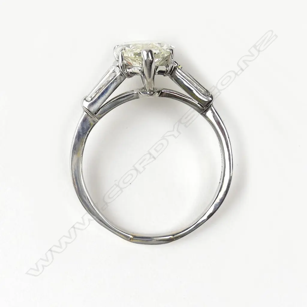 A platinum and diamond solitaire ring Image 1++