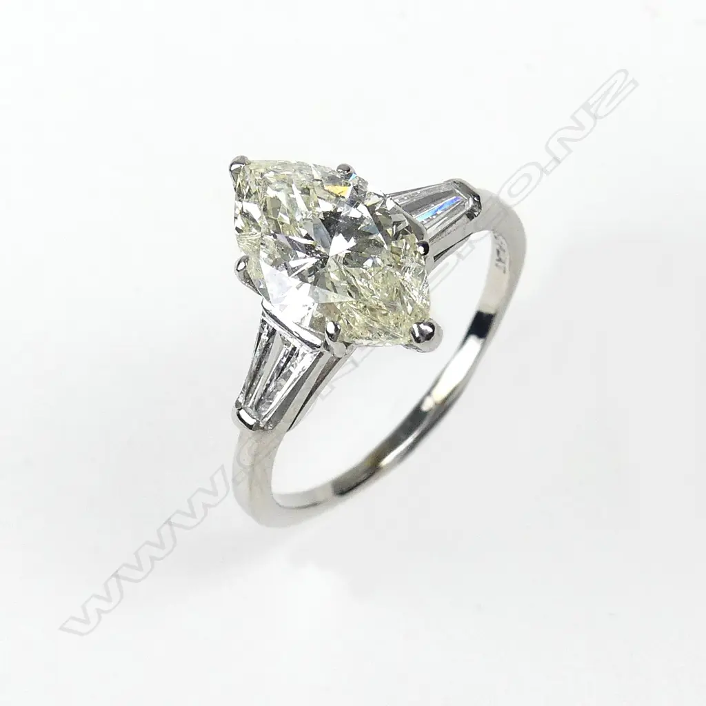 A platinum and diamond solitaire ring Image 1++
