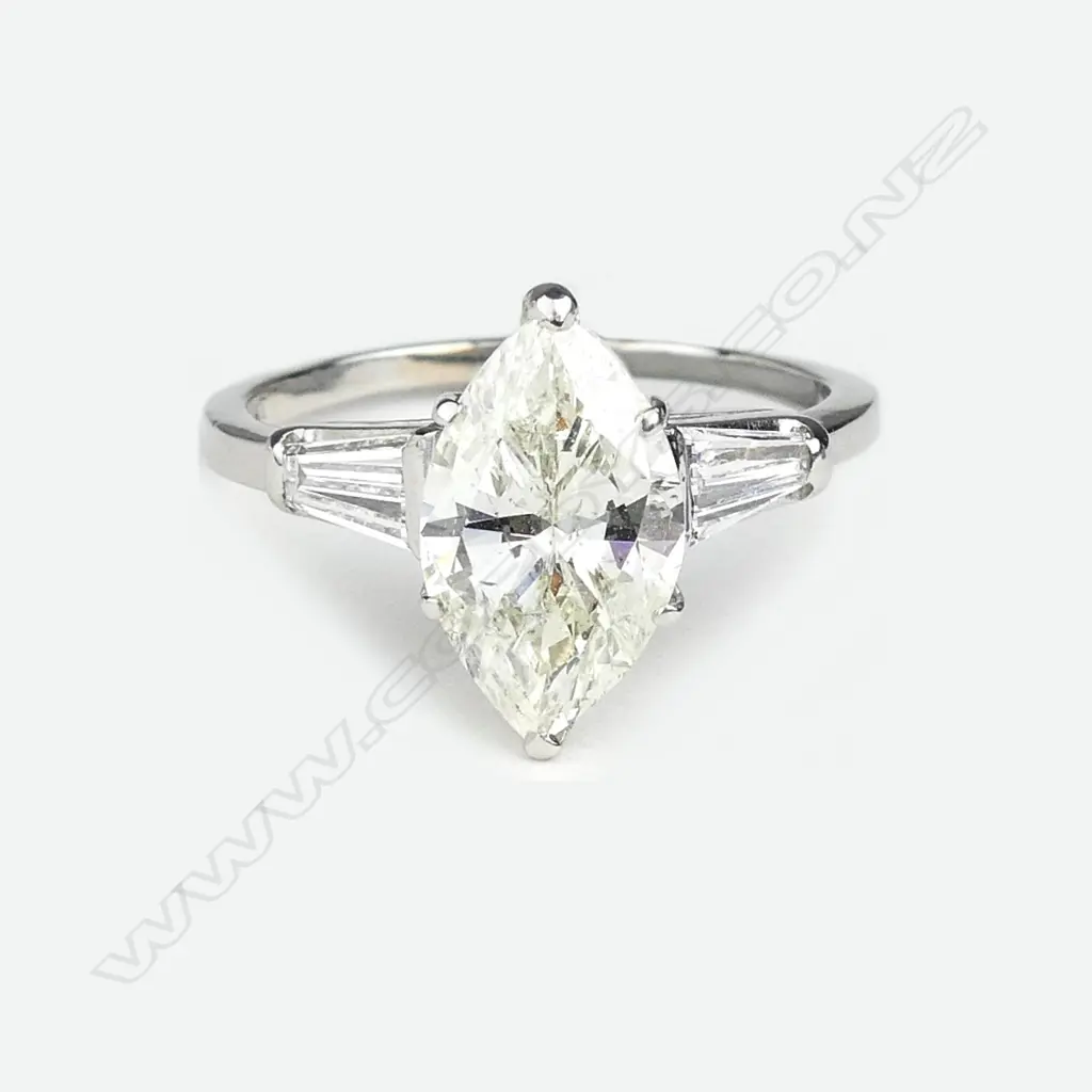 A platinum and diamond solitaire ring Image 1++