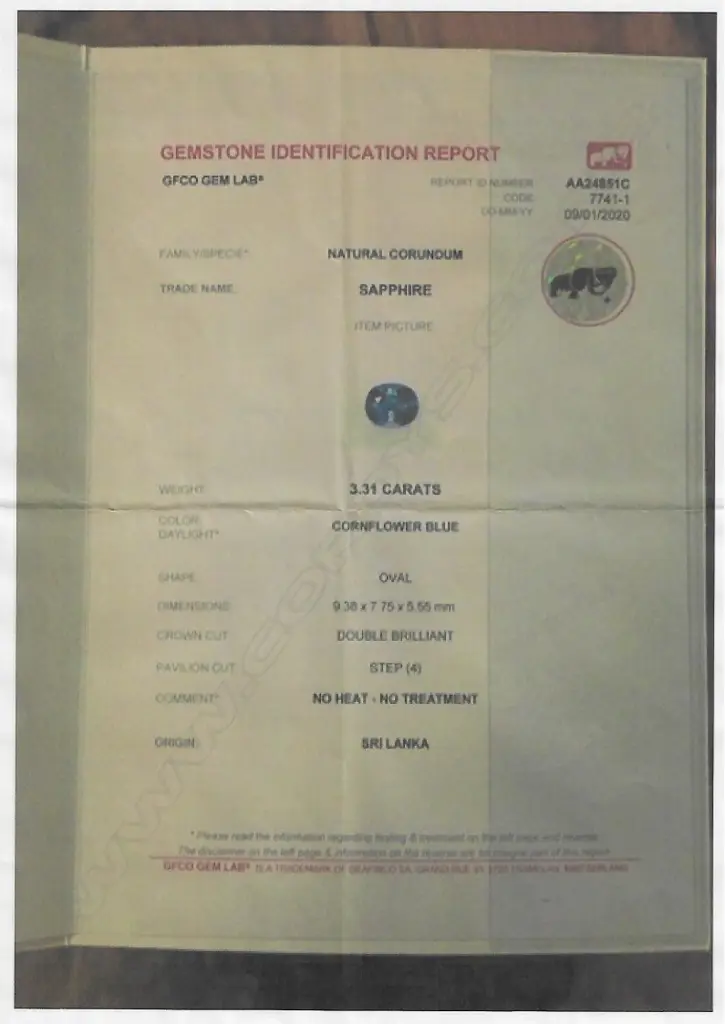 An 18ct gold natural 'cornflower blue' sapphire and diamond ring Image 1++