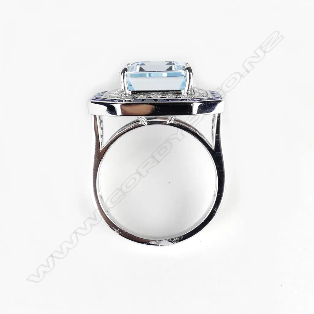 An 18ct white gold topaz sapphire and diamond ring Image 1++