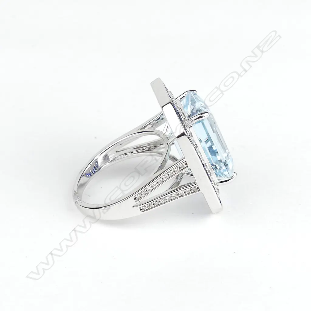 An 18ct white gold topaz sapphire and diamond ring Image 1++