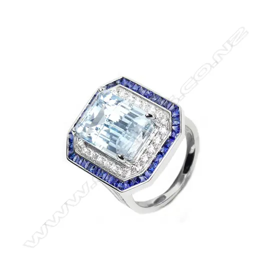 An 18ct white gold topaz sapphire and diamond ring