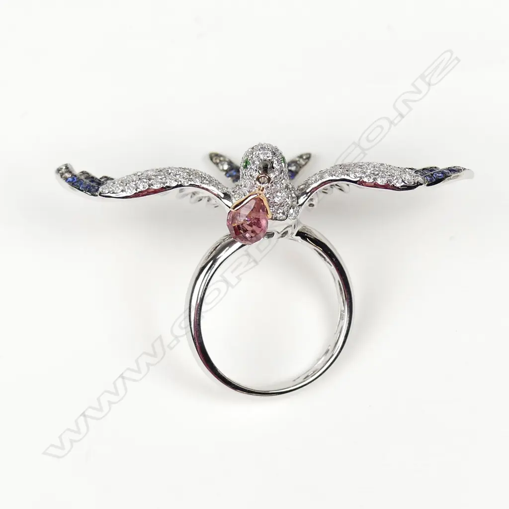 A uniquely designed 18ct. white gold diamond and sapphire ring Image 1++