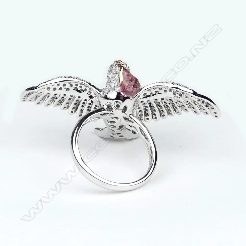 A uniquely designed 18ct. white gold diamond and sapphire ring Image 1++