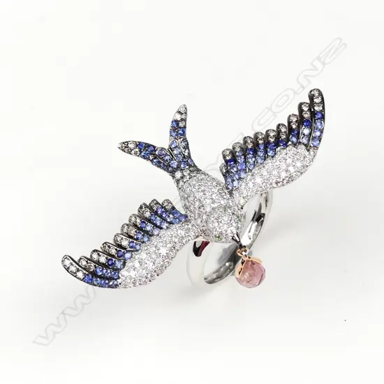 A uniquely designed 18ct. white gold diamond and sapphire ring