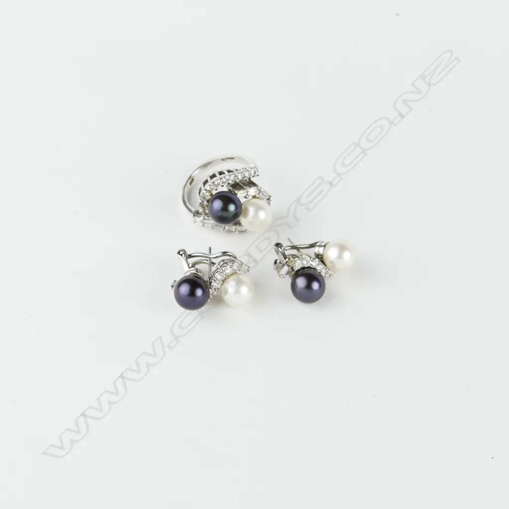 An impressive 14ct. white gold diamond and pearl ring and earrings suite Image 1++