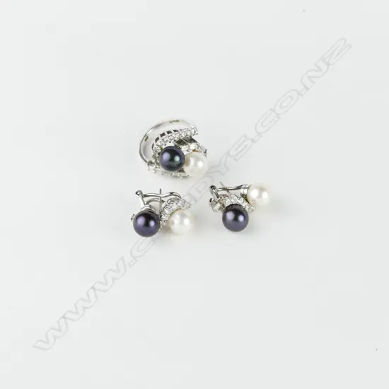 An impressive 14ct. white gold diamond and pearl ring and earrings suite