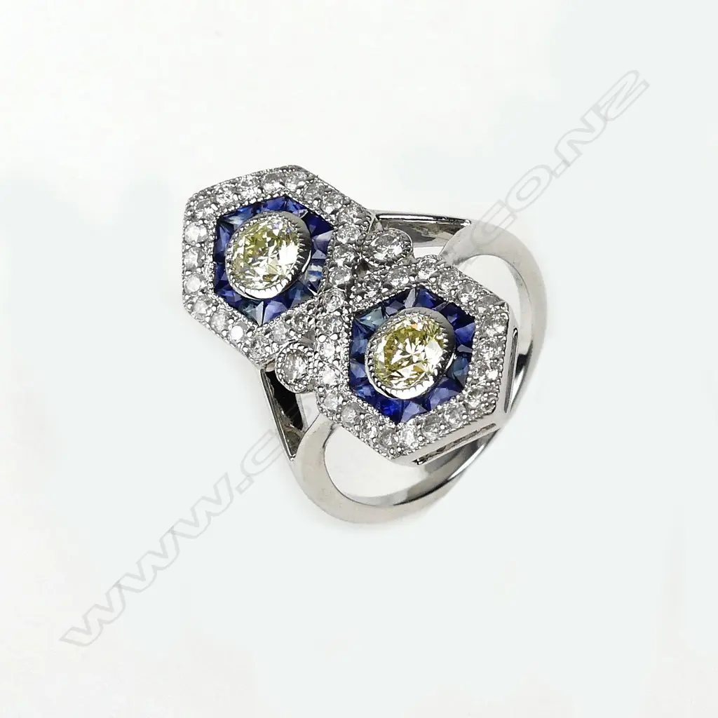 An 18ct. white gold diamond and sapphire Art Deco style ring Image 1++