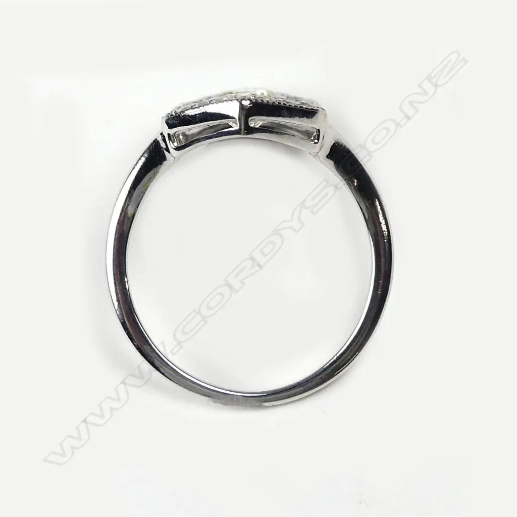 An 18ct. white gold diamond and sapphire Art Deco style ring Image 1++