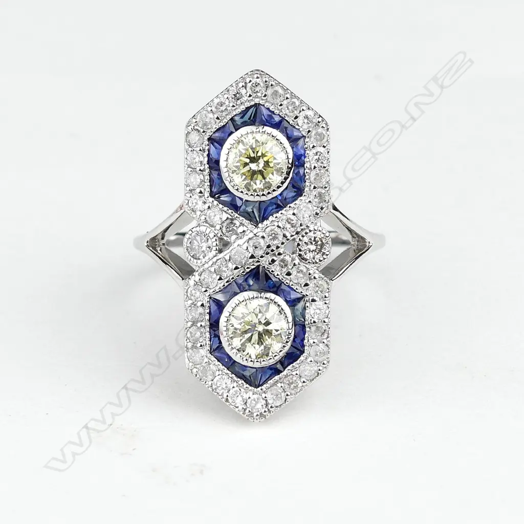 An 18ct. white gold diamond and sapphire Art Deco style ring Image 1++