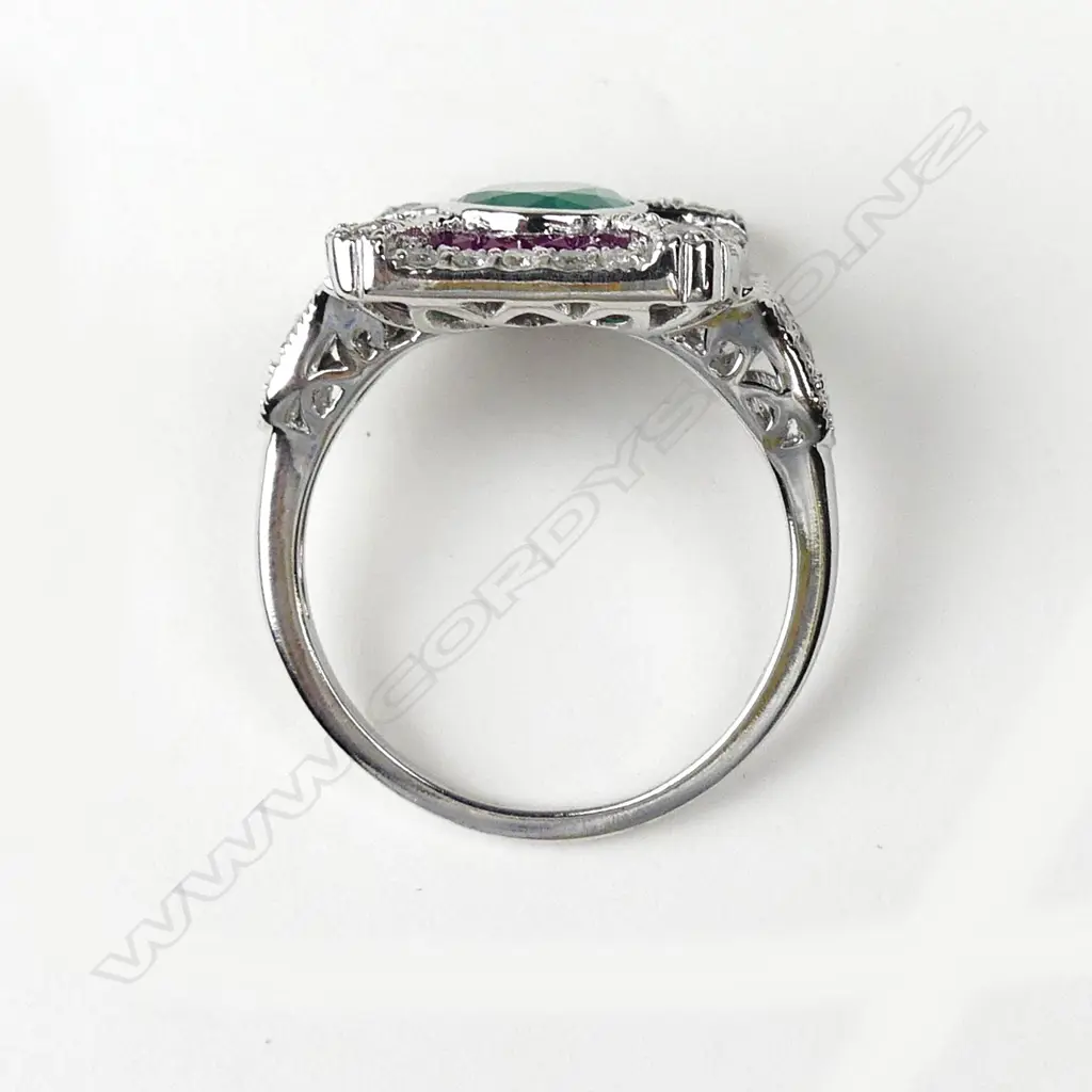 An 18ct white gold emerald ruby and diamond ring Image 1++