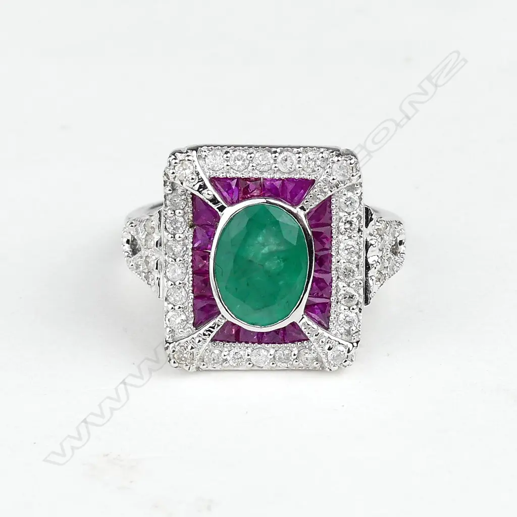 An 18ct white gold emerald ruby and diamond ring Image 1++