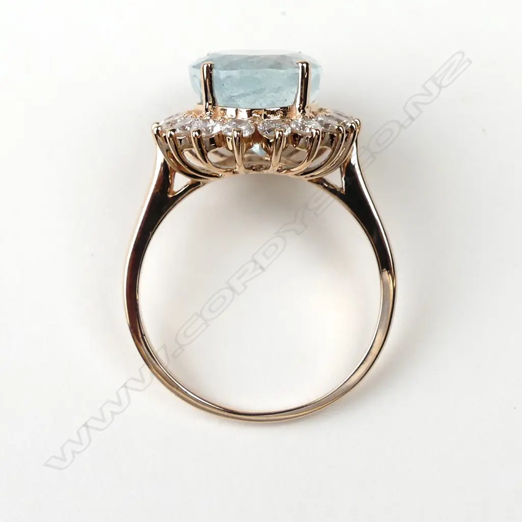 A 14ct rose gold aquamarine and diamond ring Image 1++