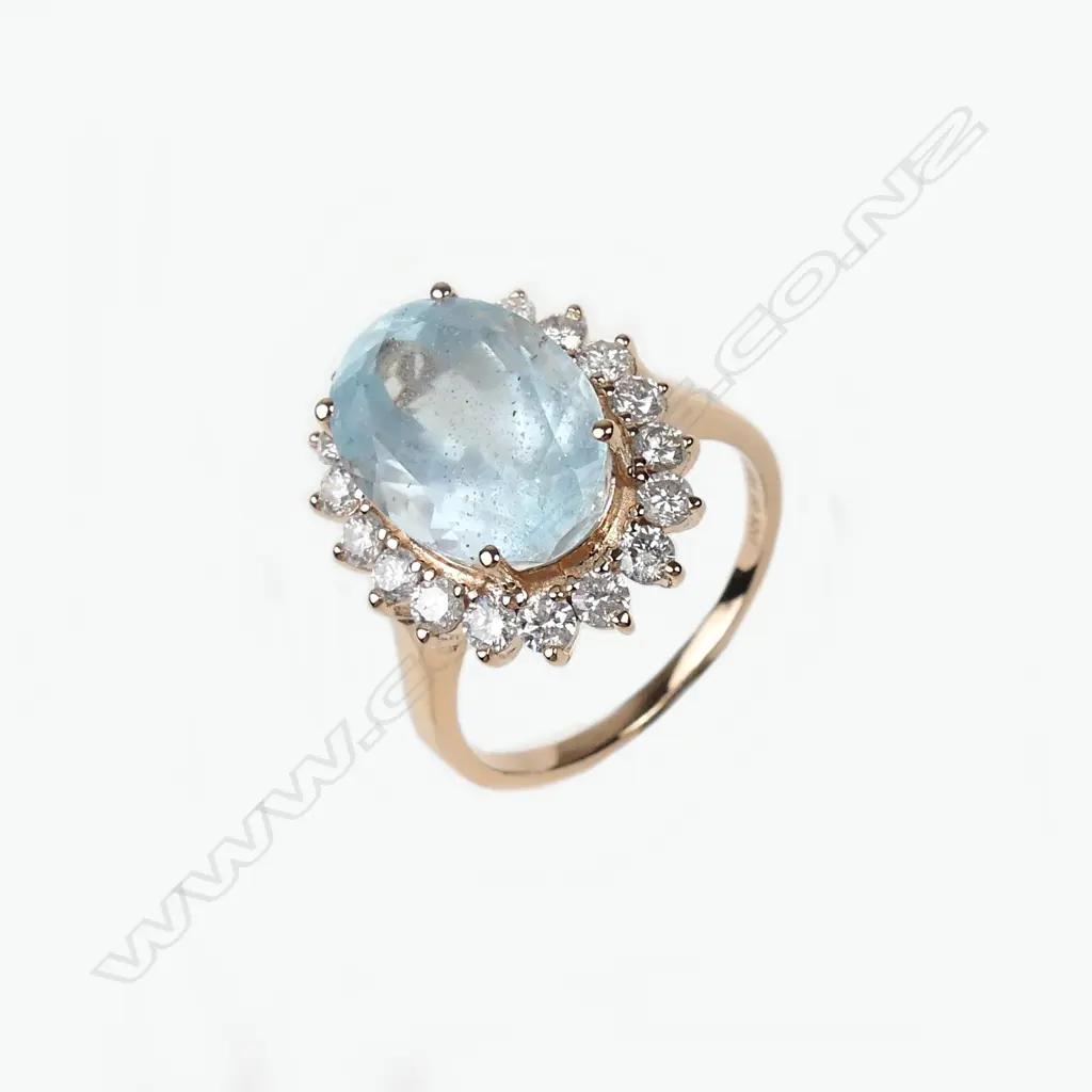 A 14ct rose gold aquamarine and diamond ring Image 1++