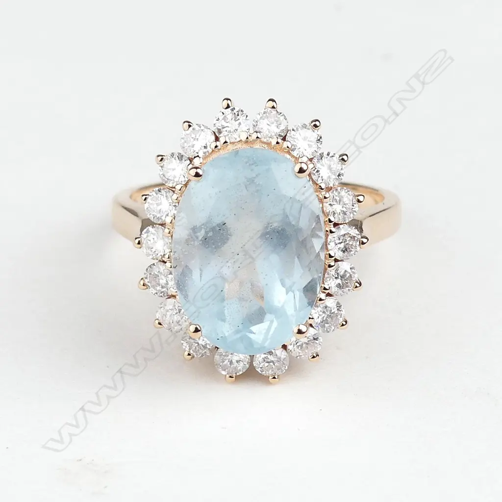 A 14ct rose gold aquamarine and diamond ring Image 1++