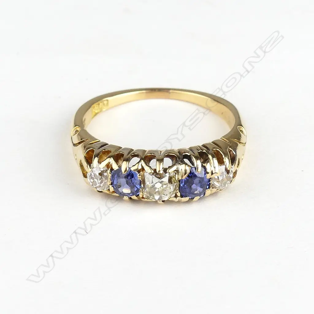 An 18ct gold sapphire and diamond ring Image 1++