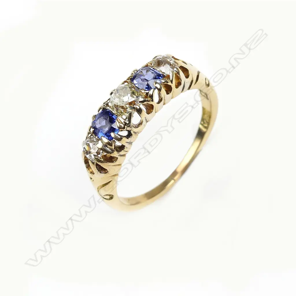 An 18ct gold sapphire and diamond ring Image 1++