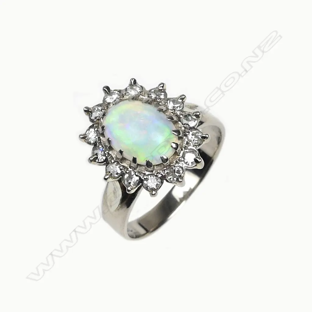 An 18ct white gold opal and diamond ring Image 1++