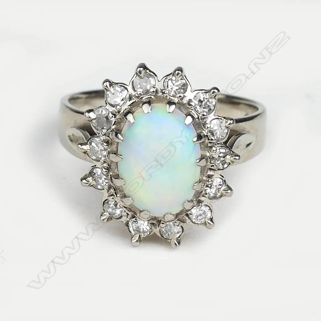 An 18ct white gold opal and diamond ring Image 1++