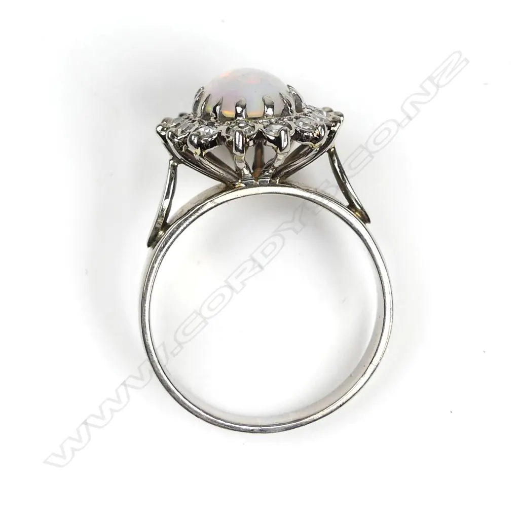 An 18ct white gold opal and diamond ring Image 1++