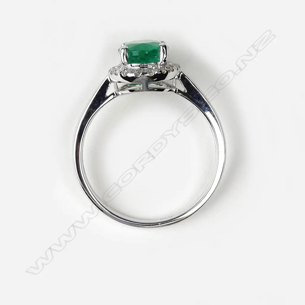 A 14ct white gold emerald and diamond ring Image 1++