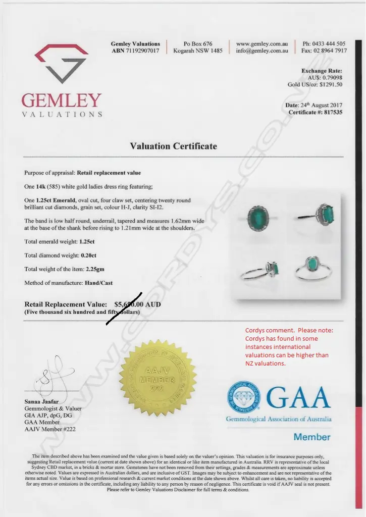 A 14ct white gold emerald and diamond ring Image 1++