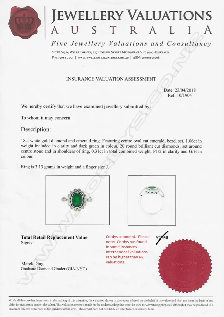 An 18ct white gold emerald and diamond ring Image 1++