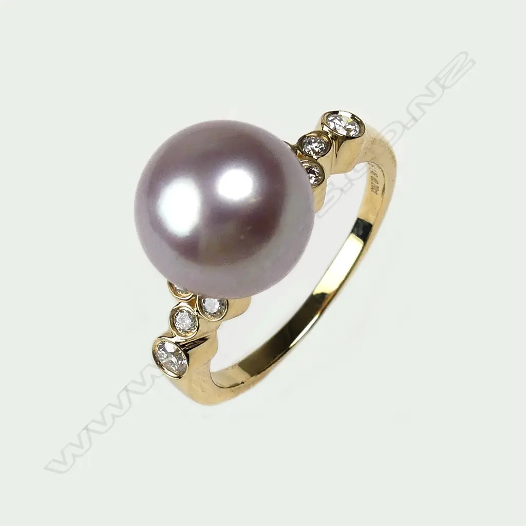 A 14ct gold pearl and diamond ring Image 1++