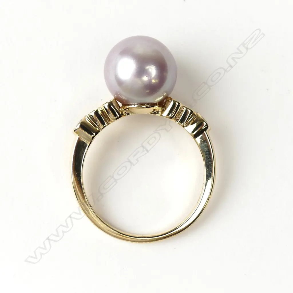 A 14ct gold pearl and diamond ring Image 1++