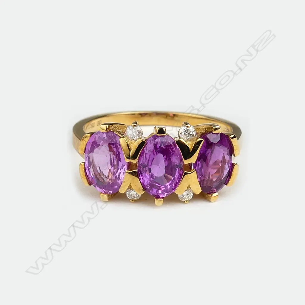 A 14ct gold sapphire and diamond ring Image 1++
