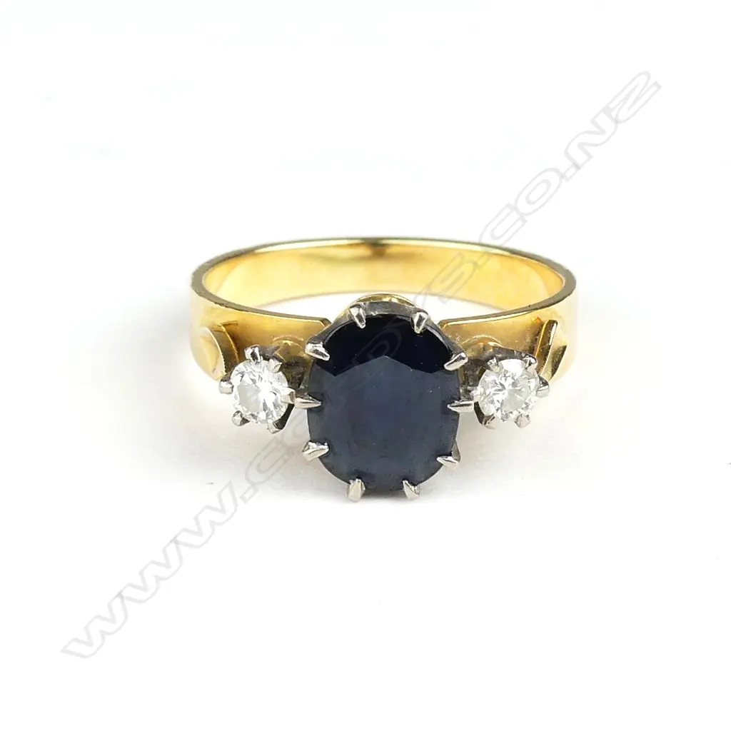 An 18ct. gold sapphire and two diamond ring Image 1++