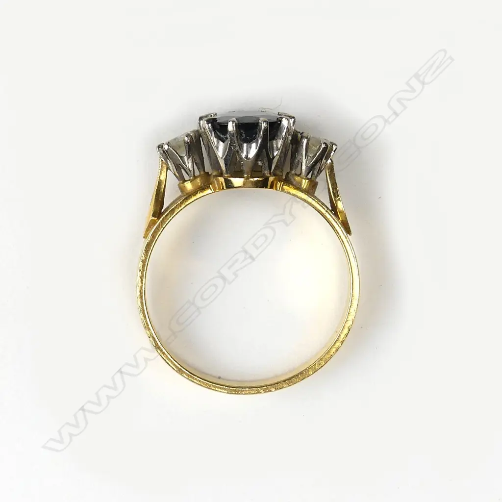 An 18ct. gold sapphire and two diamond ring Image 1++
