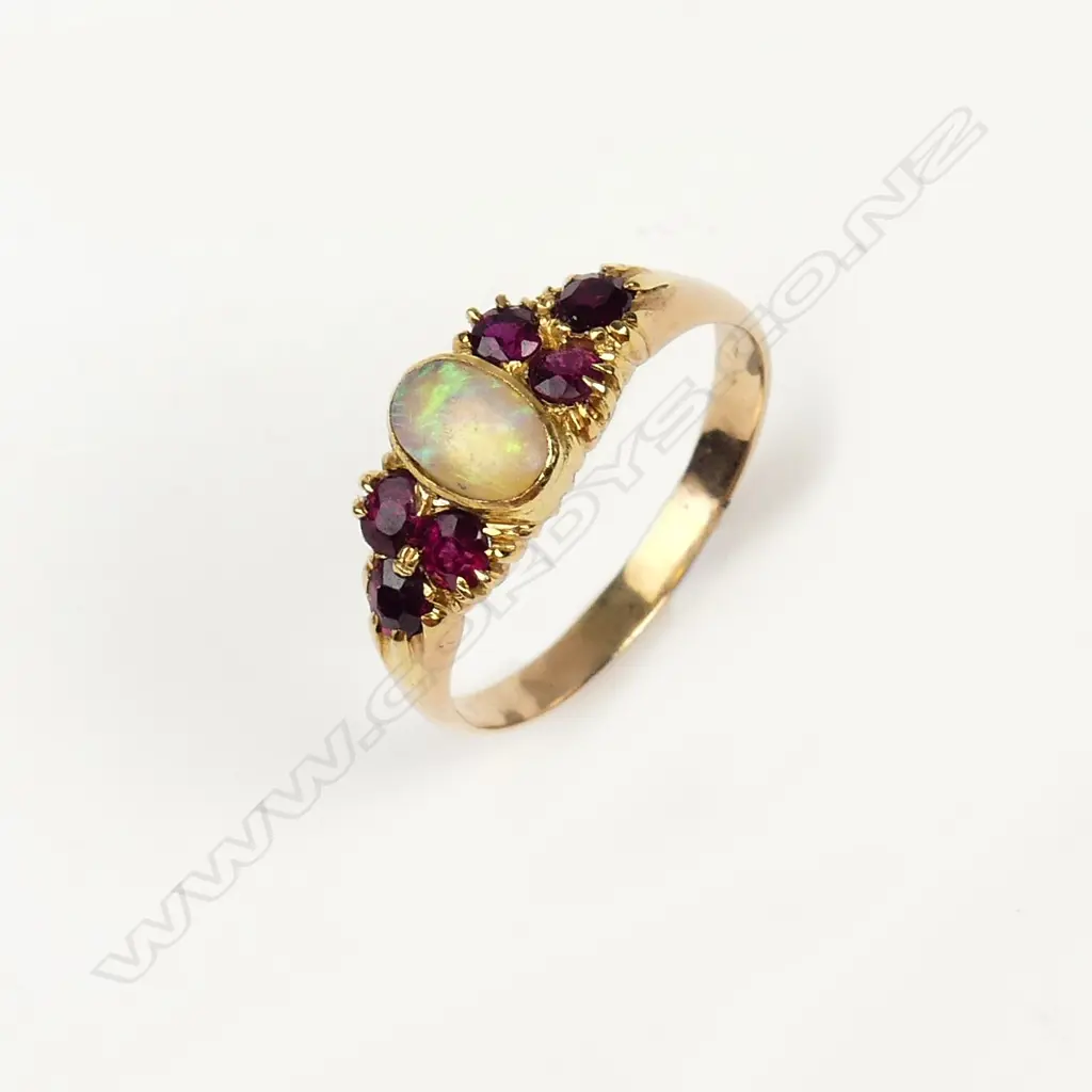 A vintage 9ct. yellow gold opal and ruby ring Image 1++