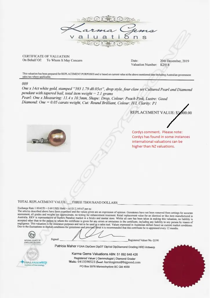 A 14ct white gold pearl and diamond pendant Image 1++