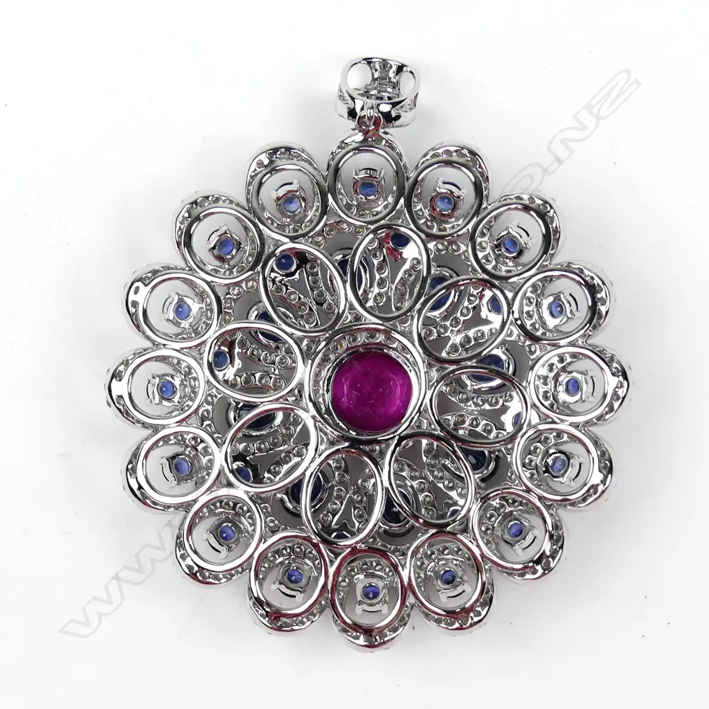 A large and impressive 18ct. white gold sapphire and diamond disc form pendant Image 1++
