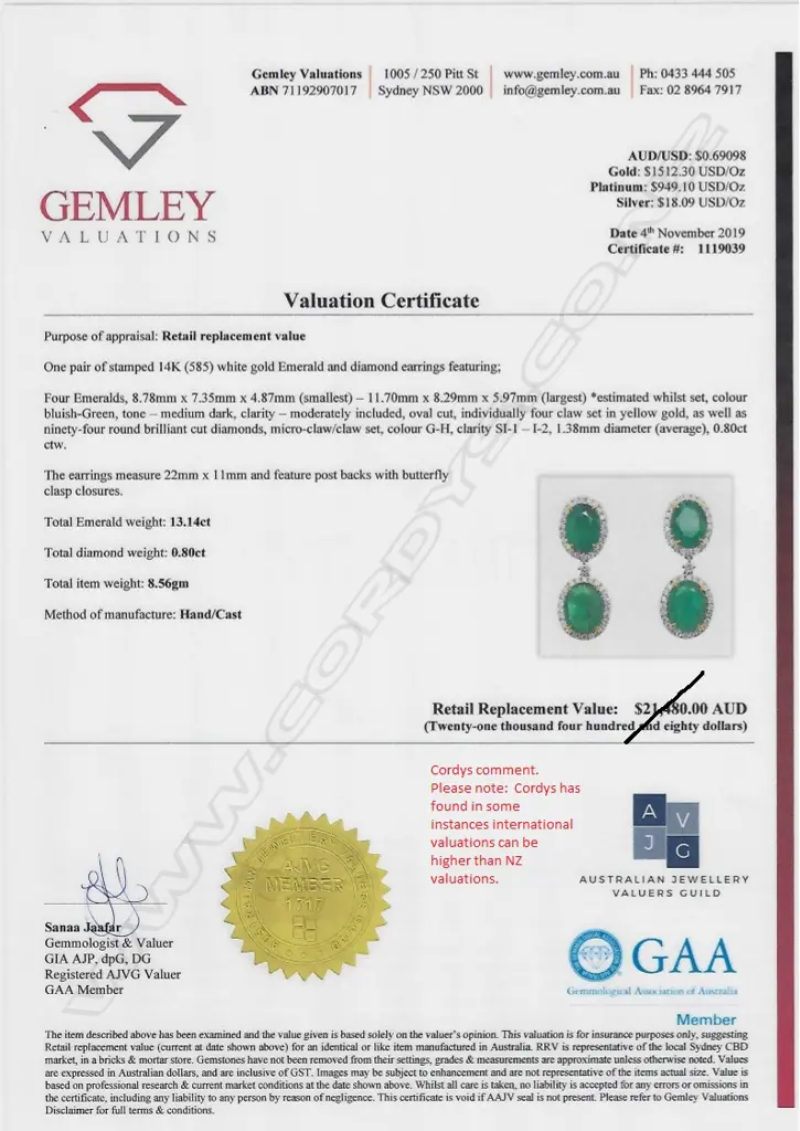 A pair of 14ct white gold emerald and diamond drop earrings Image 1++