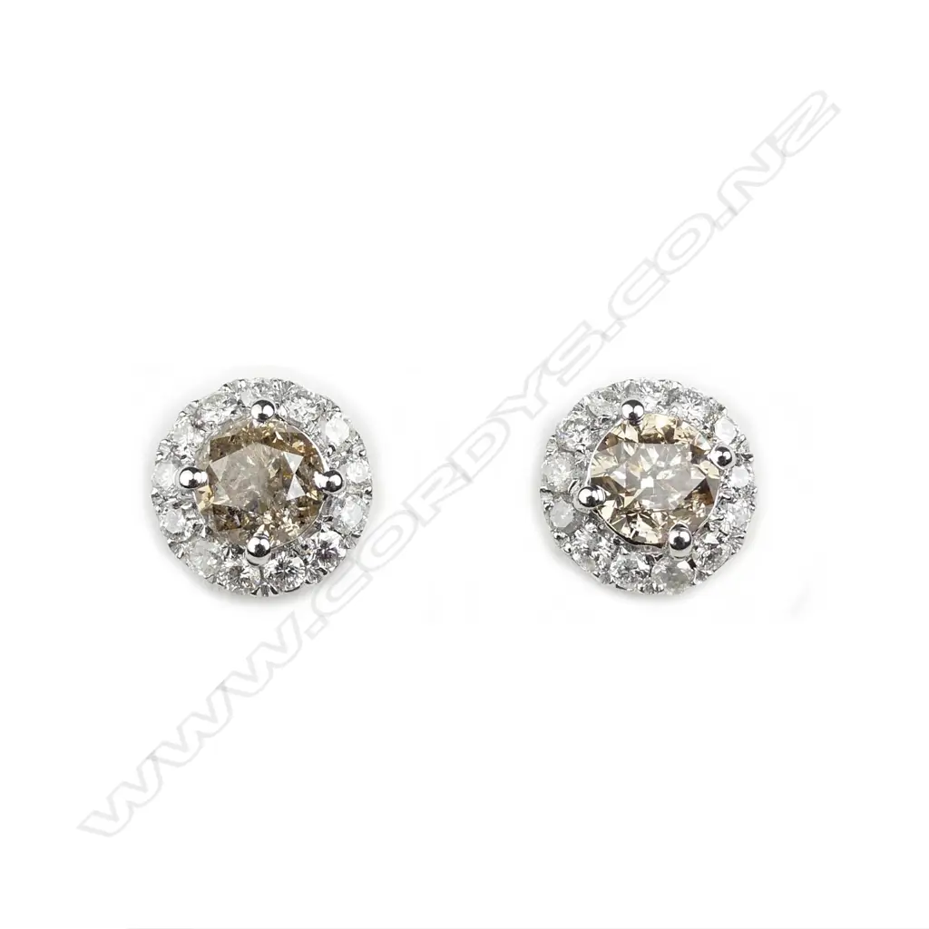A pair of 14ct white gold and diamond earrings Image 1++