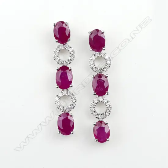 A pair of 14ct white gold ruby and diamond drop earrings