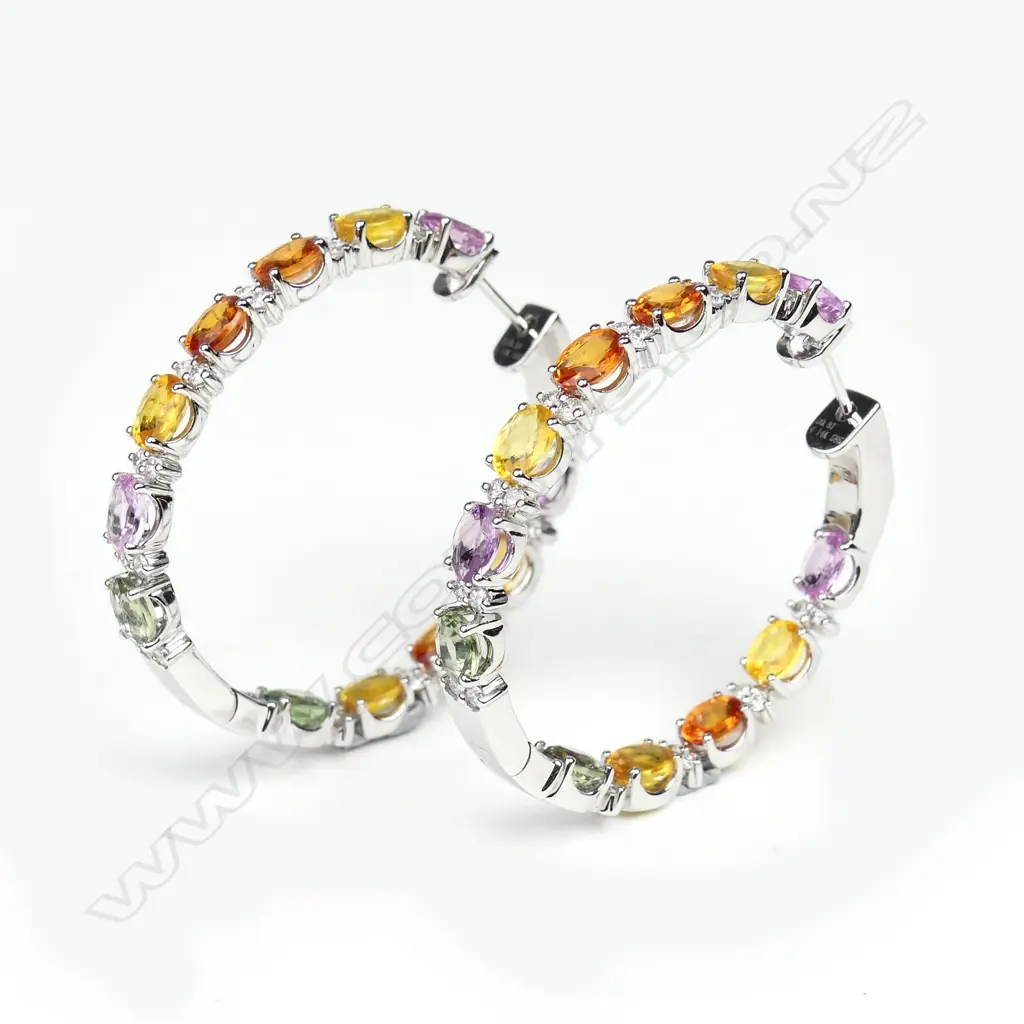 A pair of 14ct white gold sapphire and diamond hoop earrings Image 1++