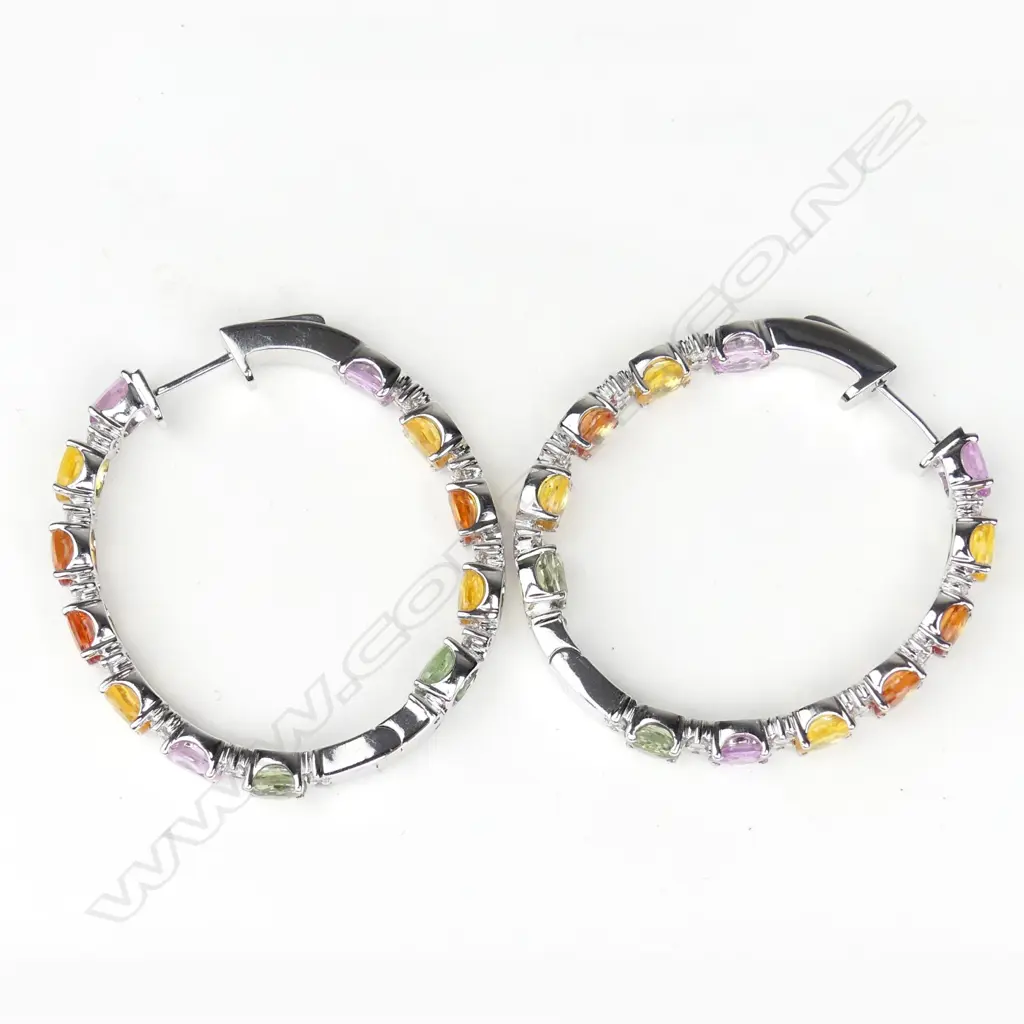 A pair of 14ct white gold sapphire and diamond hoop earrings Image 1++