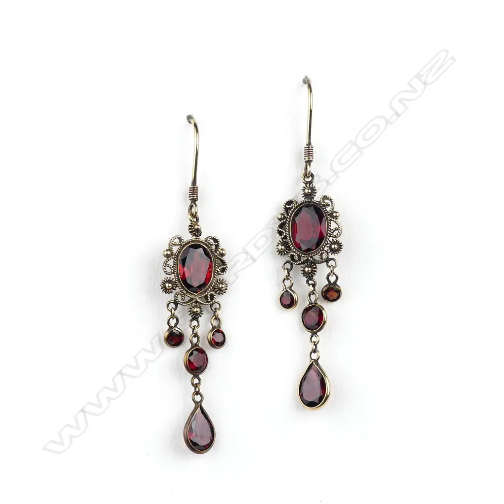 A pair of 9ct gold and garnet earrings Image 1++
