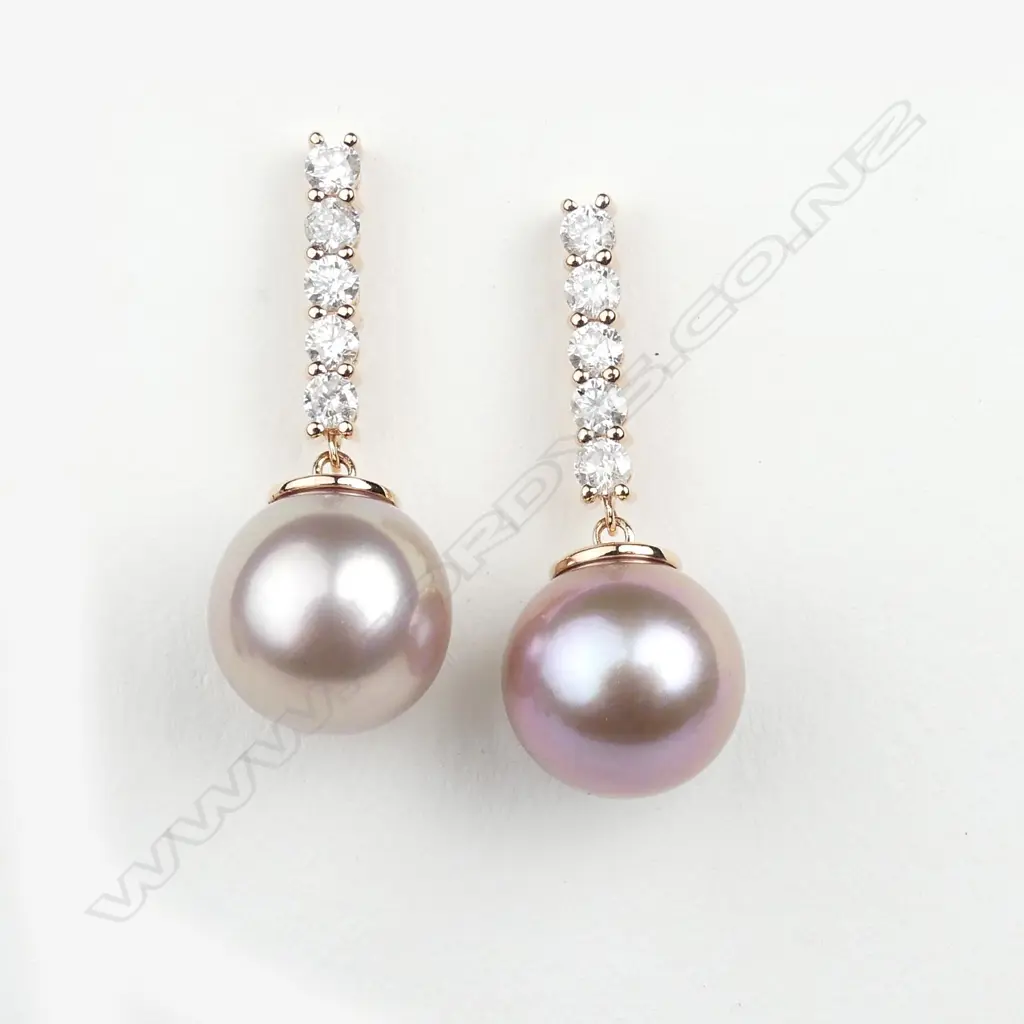 A pair of 14ct rose gold diamond and pearl earrings Image 1++