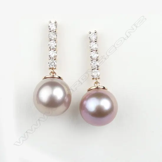 A pair of 14ct rose gold diamond and pearl earrings