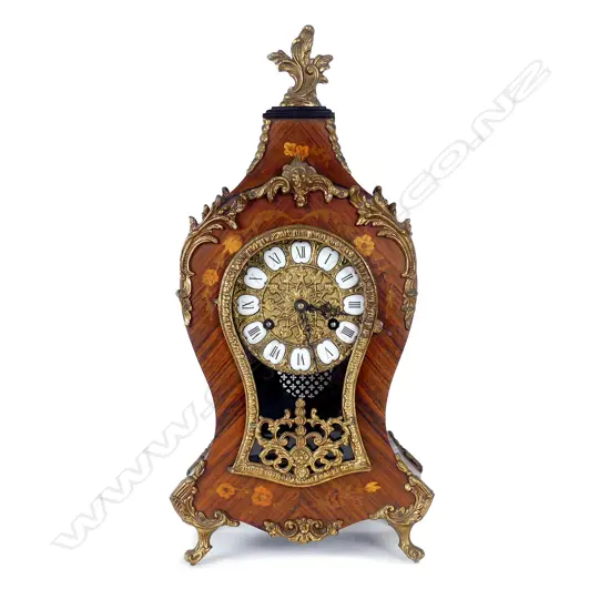 A Continental kingwood mantel clock